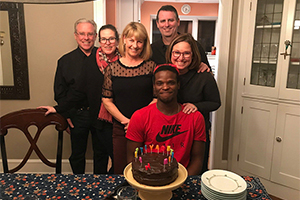 group of people smiling and celebrating a birthday