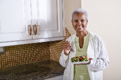 Older woman eating a health salad